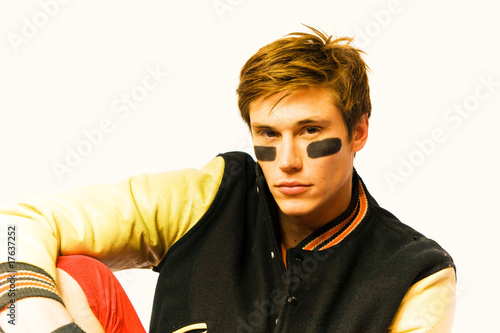 football player relaxing on the bench photo