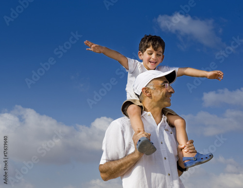 child on man shoulders