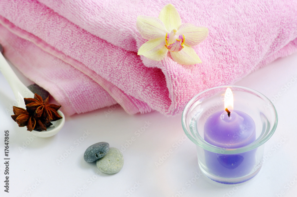 spa concept with candles orchids towels and stones on wet wooden spa concept with candles orchids towels and stones on wet wooden