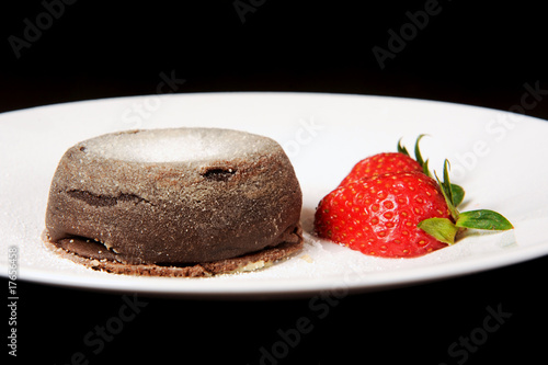 Chocolate dessert with strawberry. photo
