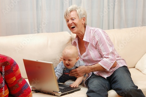 Eldrely Lady with Baby and Laptop photo