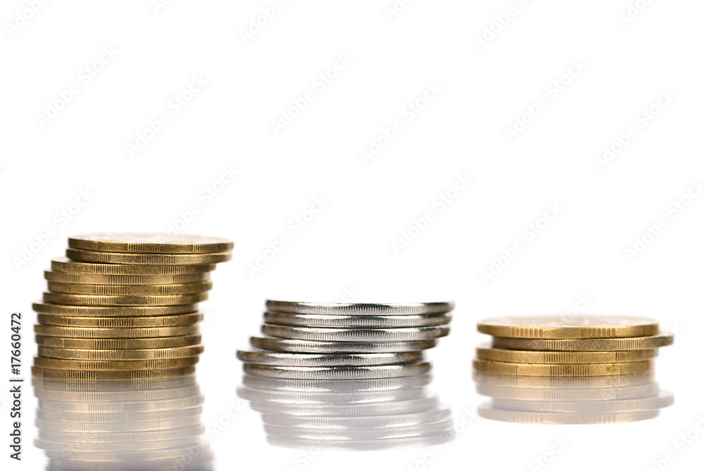 Three columns of coins isolated on white Three columns of coins isolated on white