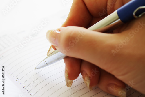 Hand write a message on empty notebook