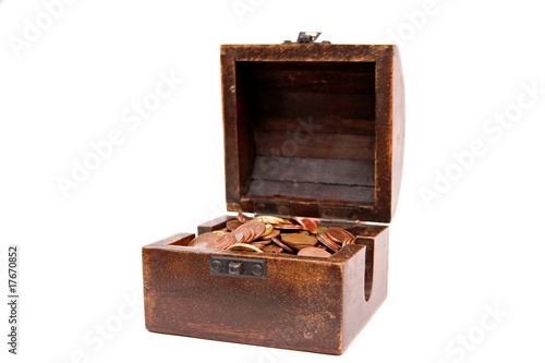 A wooden ancient chest full of money..