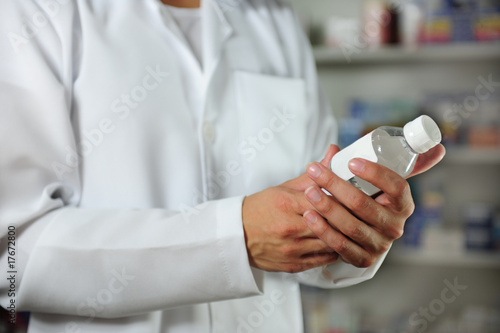 pharmacist holding a tincture
