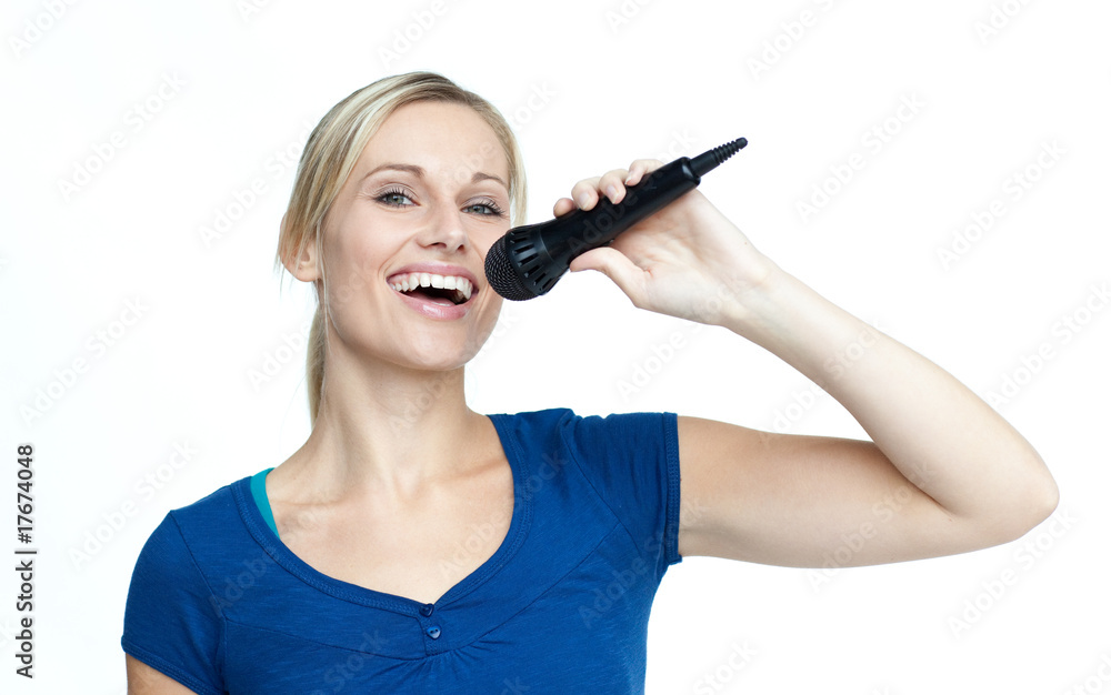 Happy girl singing on a microphone Happy girl singing on a microphone