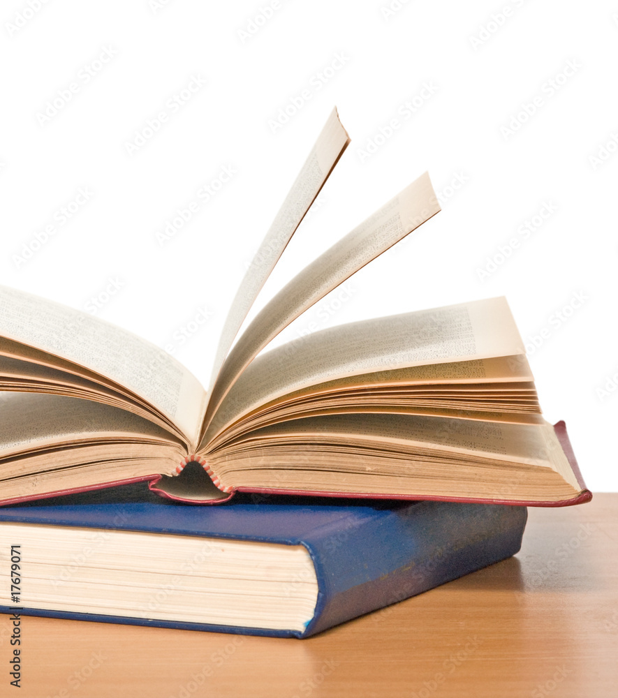 Open book on desk isolated on white background Open book on desk isolated on white background