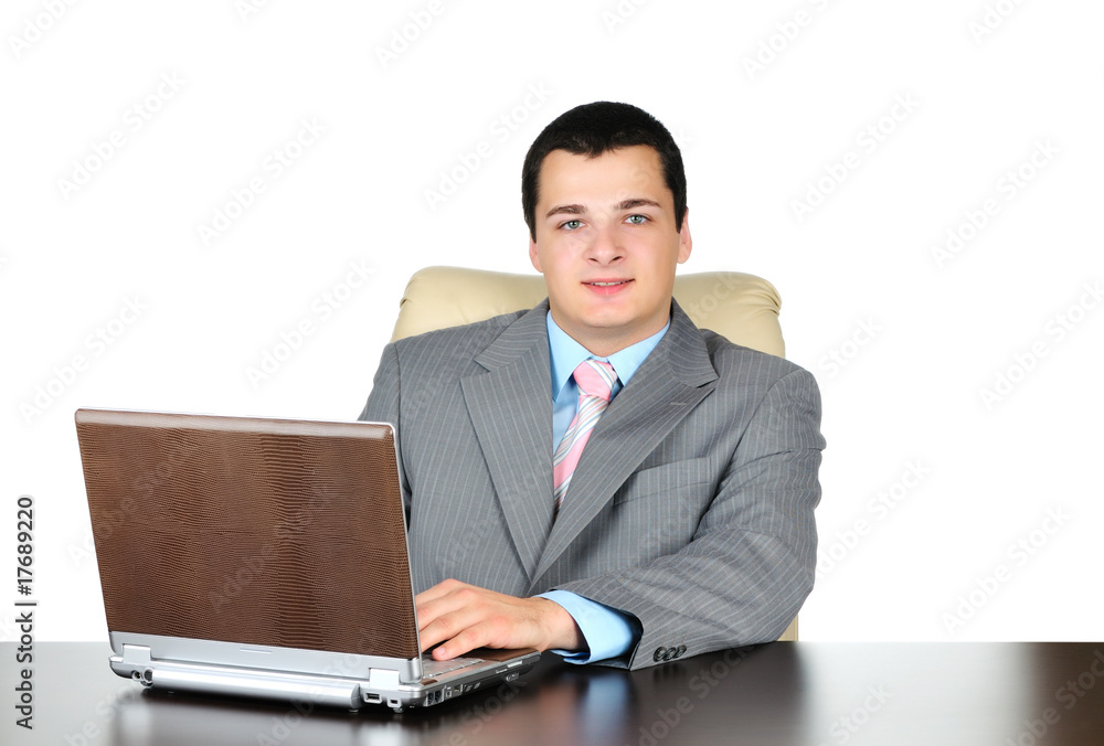 Businessman working on laptop computer. Isolated on white Businessman working on laptop computer. Isolated on white