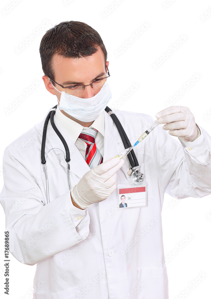 Doctor in mask fill syringe medication from ampule. Isolated Doctor in mask fill syringe medication from ampule. Isolated