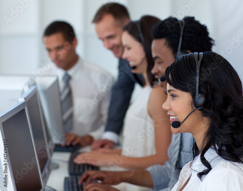 Businesswoman in a call center with her international team