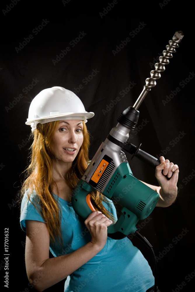 The builder in a protective helmet The builder in a protective helmet