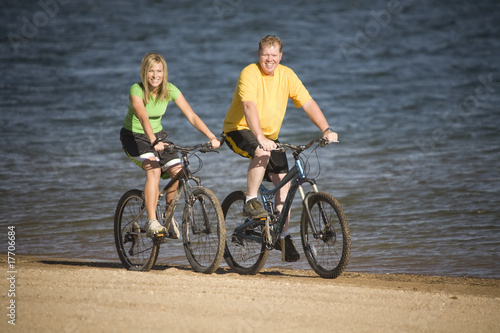 Man and woman riding bikes