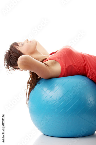 Young happy woman doing fitness exercise