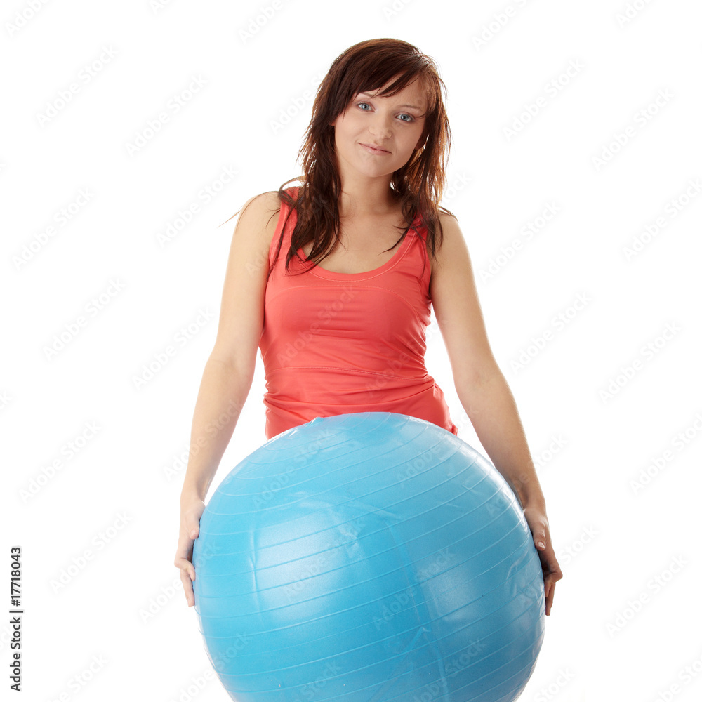 Young happy woman doing fitness exercise Young happy woman doing fitness exercise