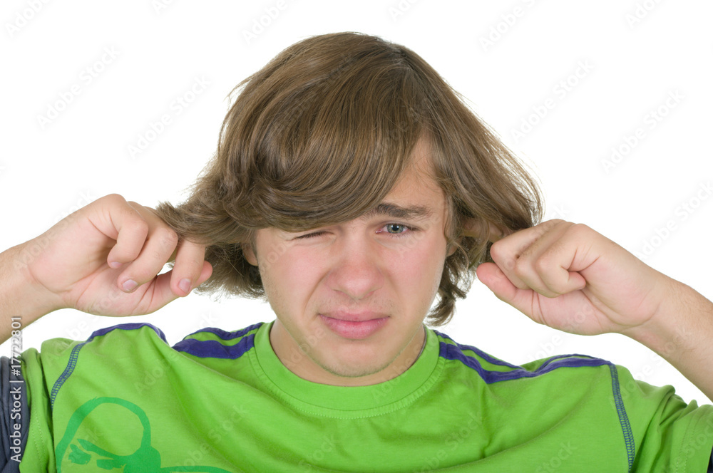 Teenager closes ears fingers Teenager closes ears fingers