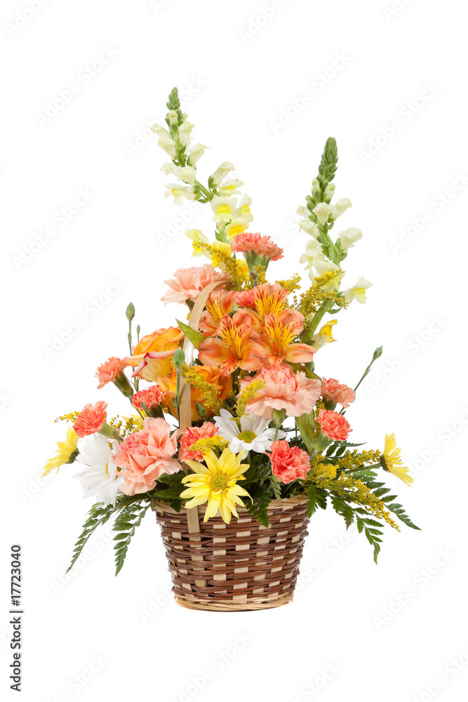 Various flowers arranged in basket on a white background