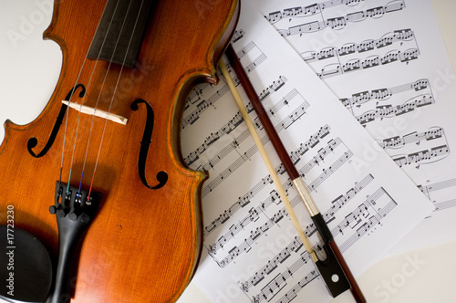 a violin and bow on sheet music