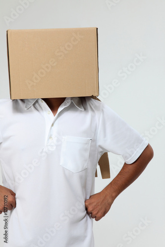 man cover himself with box