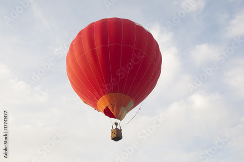 Colorful air balloon flies high in the sky © Solid photos