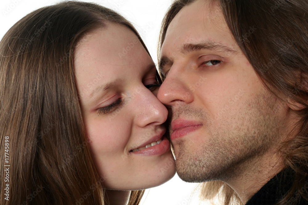 Portrait of young couple in studio isolated on white background Portrait of young couple in studio isolated on white background