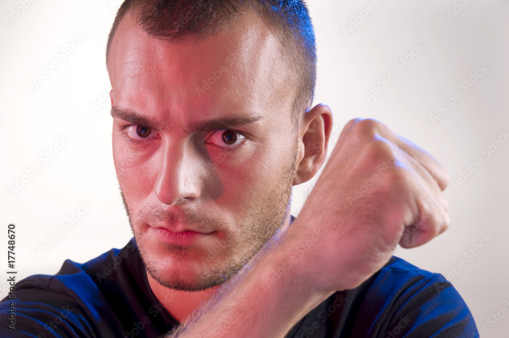 Fototapeta premium Young serious gesturing man