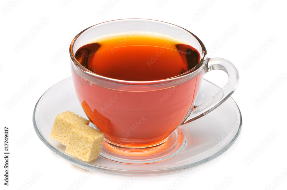 Cup of tea with lump of sugar on a white background Cup of tea with lump of sugar on a white background