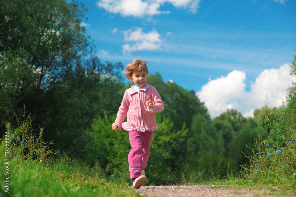 little girl walks on path outdoor in summer little girl walks on path outdoor in summer