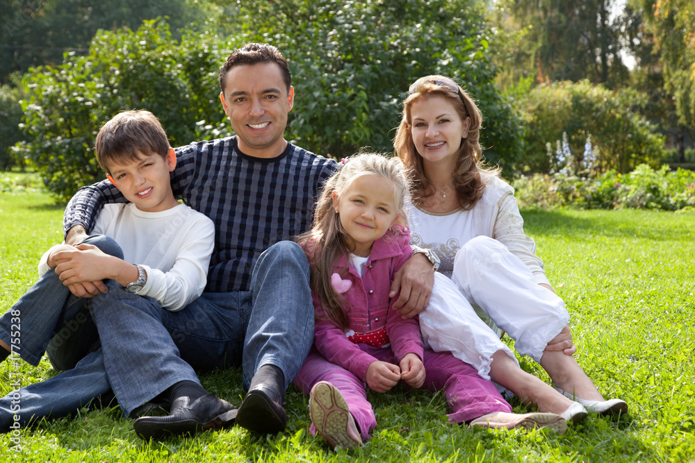 happy family of four persons outdoors happy family of four persons outdoors