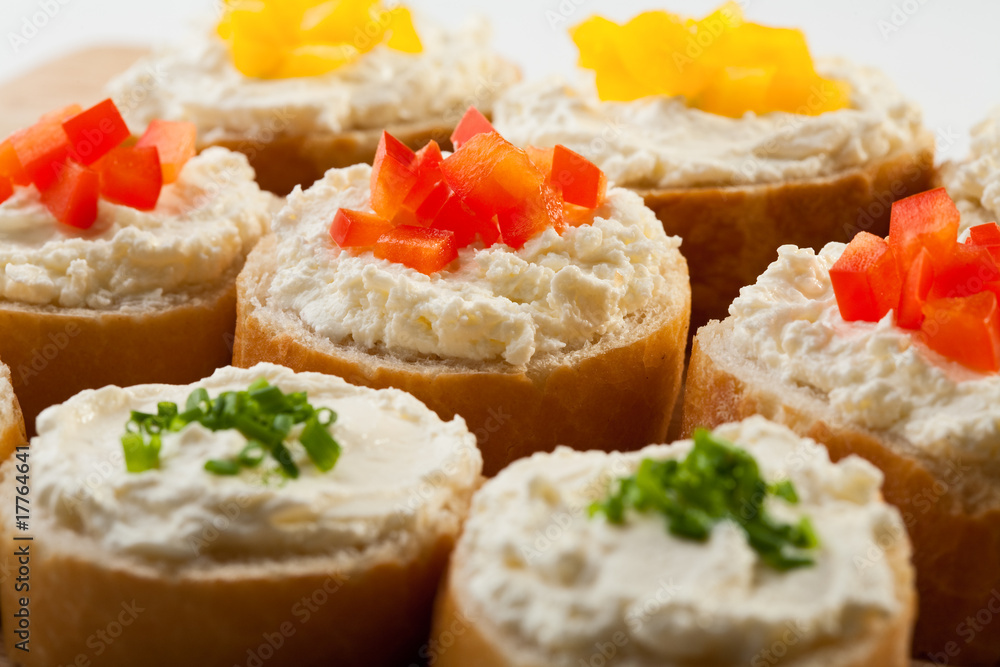 Mini sandwiches - bread with cream cheese and vegetables Mini sandwiches - bread with cream cheese and vegetables