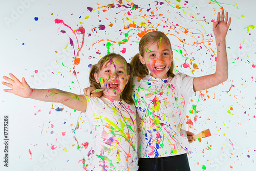Messy, Happy Girls with paint splattered everywhere