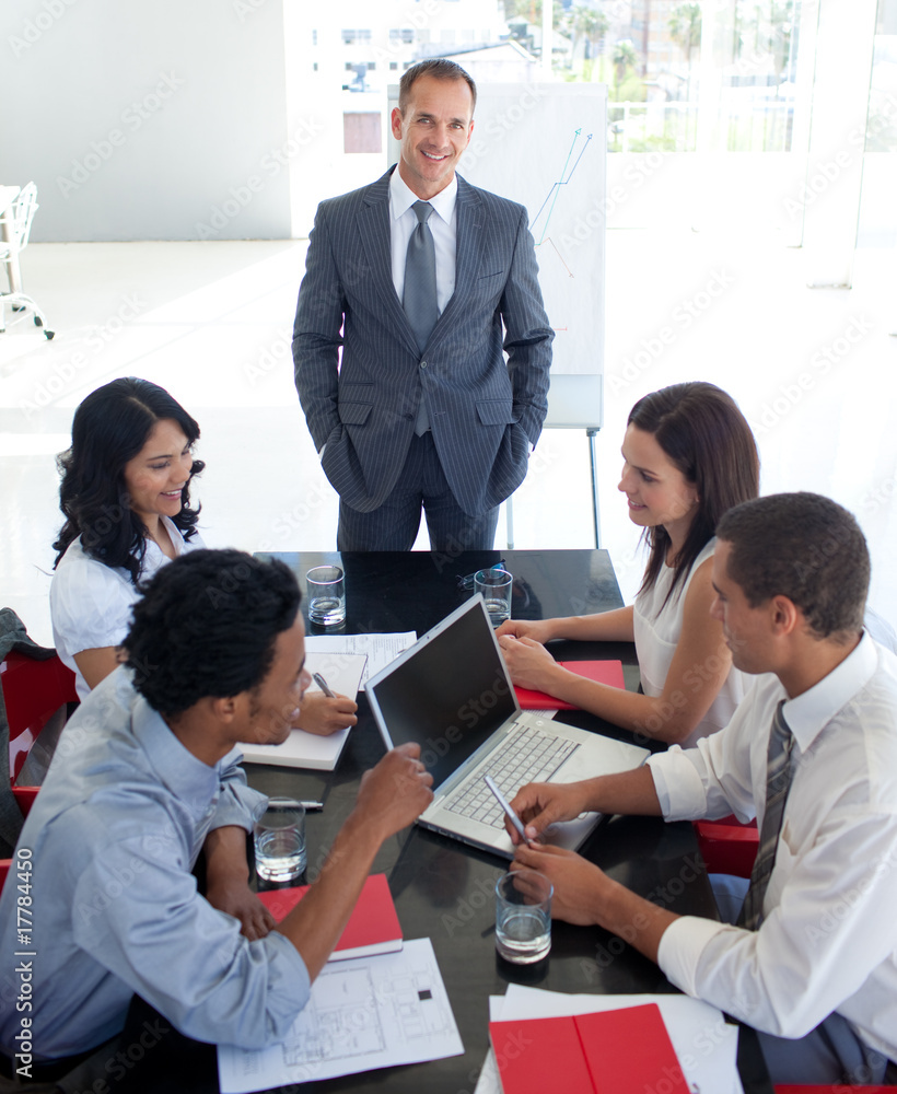 Business team studying a new business plan Business team studying a new business plan