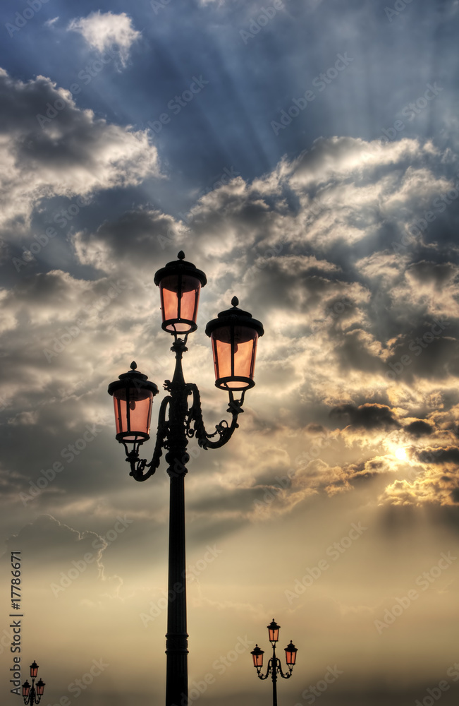 Vintage lamppost at sunrise.