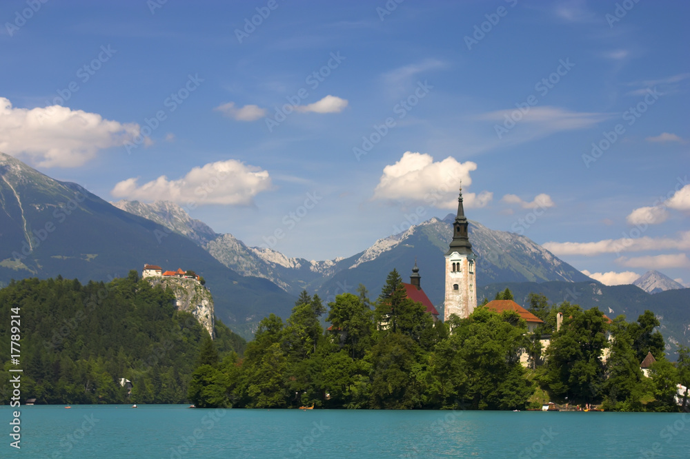 Bled lake, island, castle, church and mountains in background