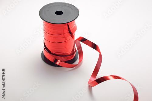 Red ribbon and spool