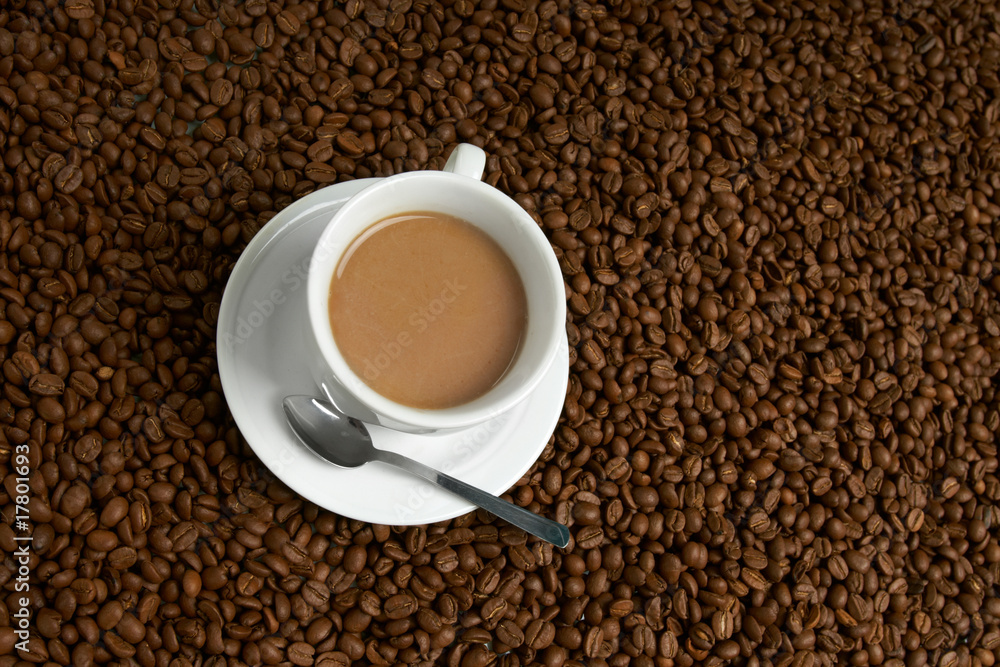 Cup with coffee, costing on coffee grain