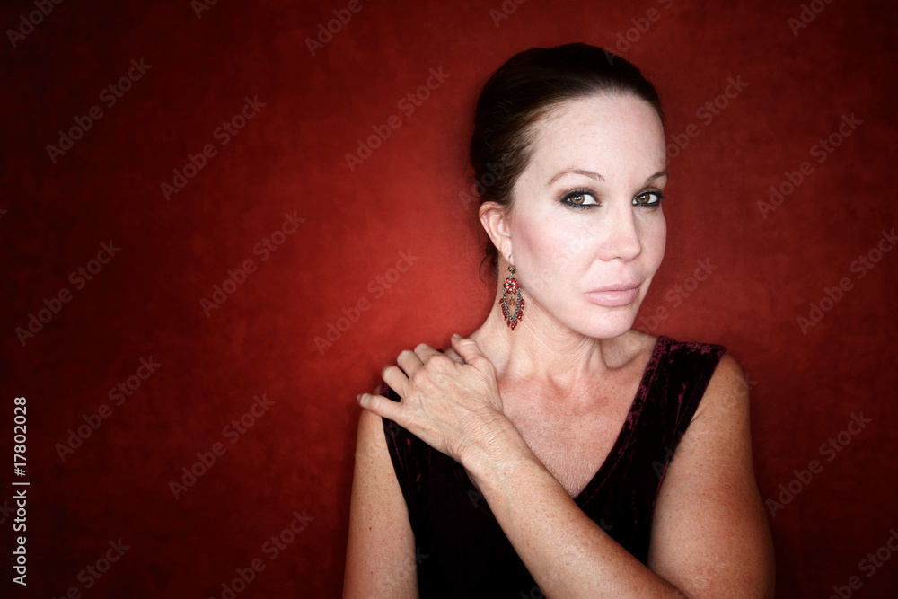 Fototapeta premium Beautiful Woman on a Red Background