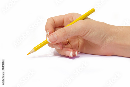 yellow pencil in female hand