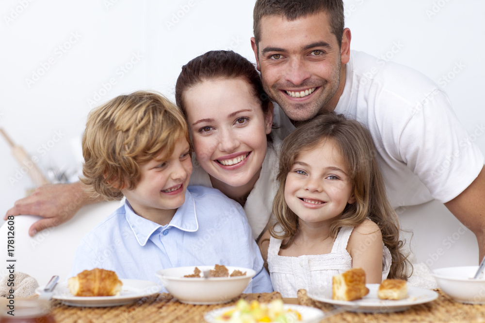 Happy family having breakfast