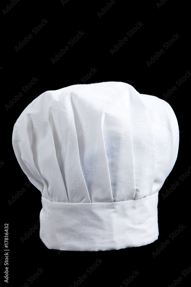 A white baker's toque on a black background - obrazy, fototapety, plakaty 
