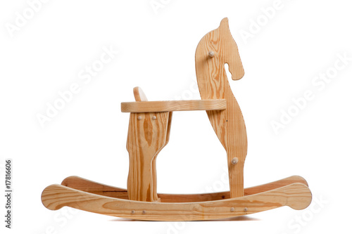 A wooden rocking horse on white