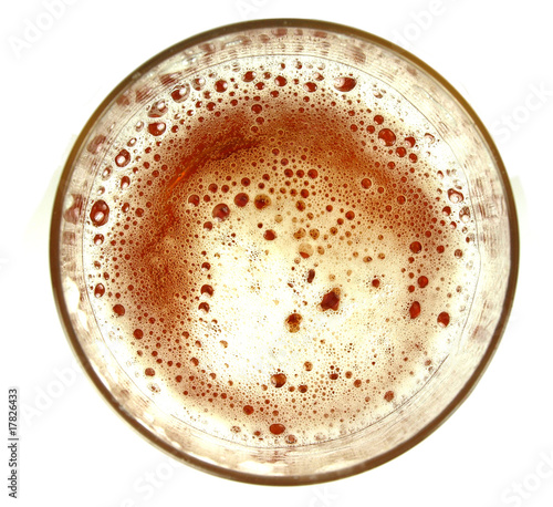 Top view on glass of beer on white background