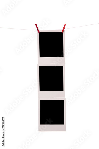 three polaroid photos with clothespins on a rope
