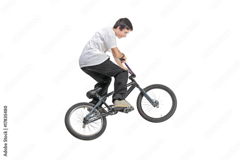 Person riding a bike in jump isolated against white background Person riding a bike in jump isolated against white background