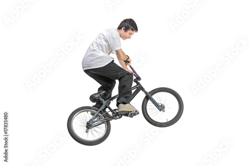 Person riding a bike in jump isolated against white background
