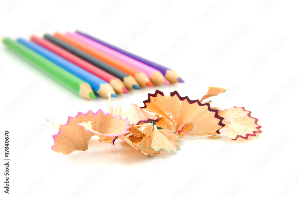 Colorful pencils and shavings over white background Colorful pencils and shavings over white background