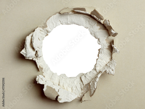 Hole in the grey plasterboard.