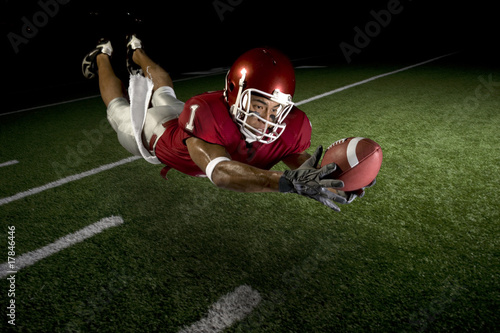 Photography Wide Receiver Making a Diving Catch