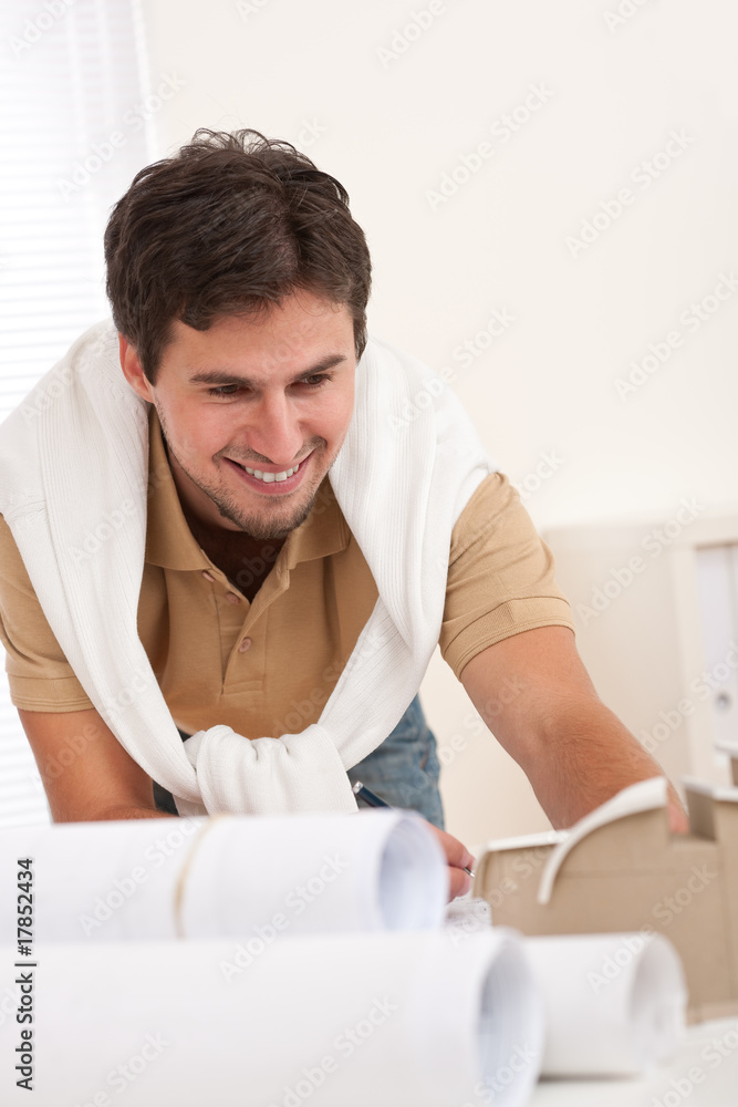 Young male architect working at office Young male architect working at office