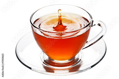 tea splash in glass cup isolated