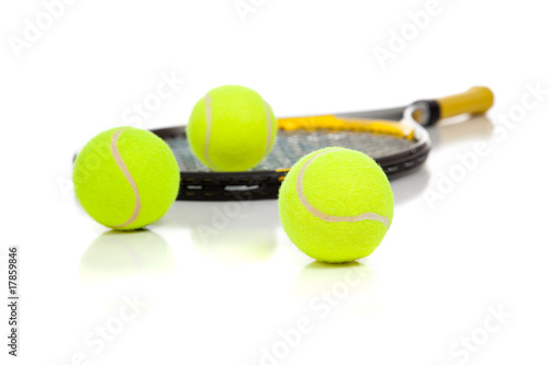 Tennis racket and balls on white © Michael Flippo